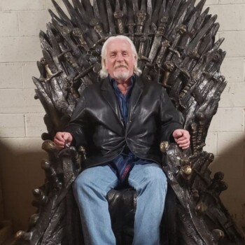 Jim sitting on The Iron Throne from HBO's Game of Thrones The Iron Throne from HBO's Game of Thrones